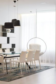 Black and white shelving in the living-dining room