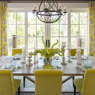 Beautiful wrought iron chandelier in the dining room interior