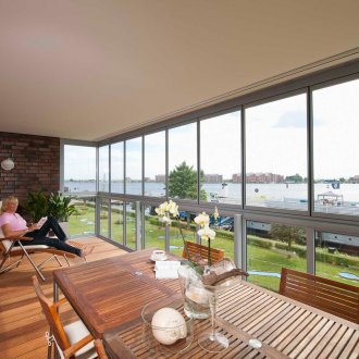 Large balcony with panoramic windows
