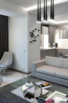 Mutfağın ve oturma odasının gri yatıştırıcı renklerde kombine alanları