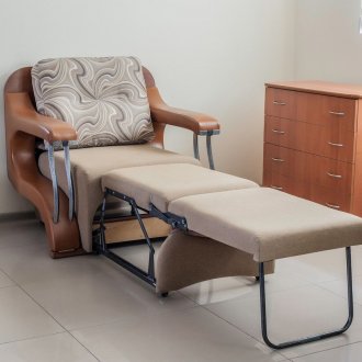 Chair bed with a folding mechanism