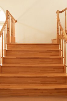 Light wooden staircase in country style