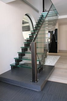 Glass staircase in front of the window