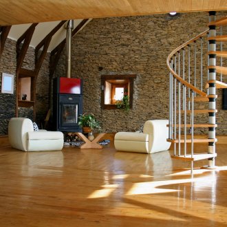 Spiral staircase in the living room of a country house