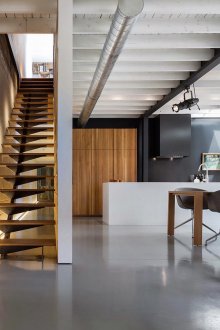 Minimalistic staircase to the second floor with lighting
