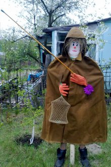 Scarecrow in a cloak