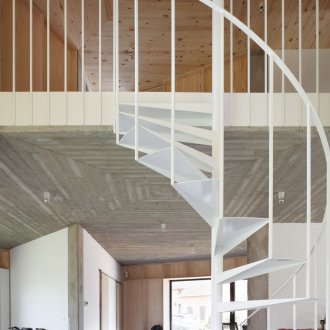 White spiral staircase in a country house