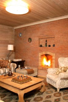 Rustic living room with fireplace in a brick wall