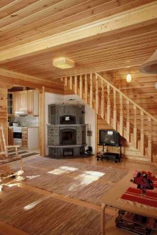 Living room with fireplace in a Russian rustic style