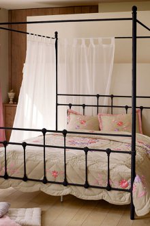 Black canopy bed