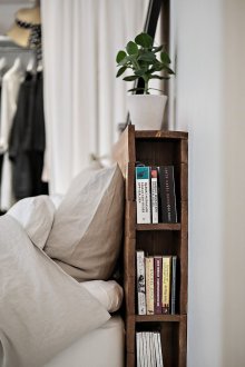 Bed with a shelf on the side