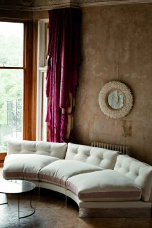 Semicircular sofa in the hallway
