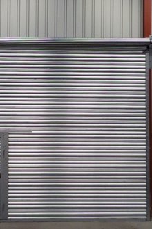 Roller shutter gates with door