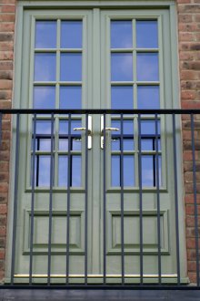 Balcony green door