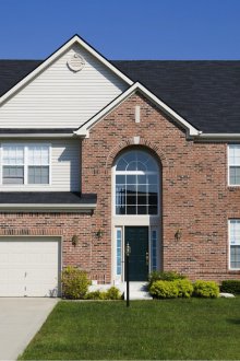 Fiber cement siding under a brick