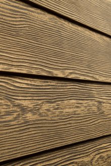 Fiber cement siding in wood texture