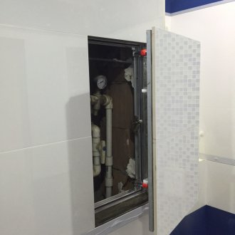 Tiled plumbing hatch