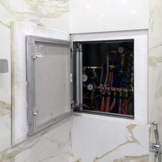 Plumbing hatch in the toilet