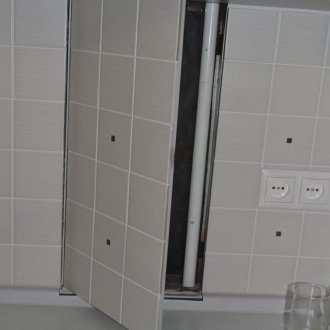 Plumbing hatch in the kitchen