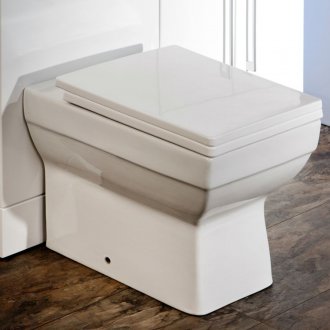 Compact toilet with horizontal outlet