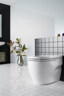 Compact heated toilet
