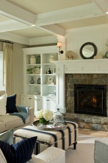 Living room interior with fireplace in bright colors.