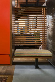 Loft hallway with bench