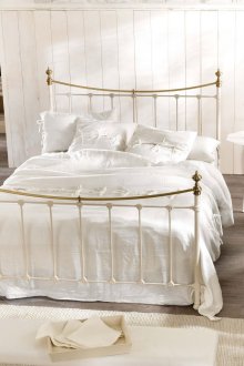 Beige and white textile in a provence bedroom