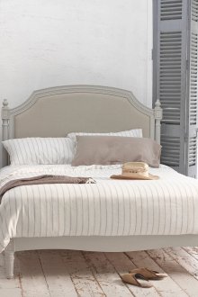 Bright spacious bedroom with Provence style wooden floors