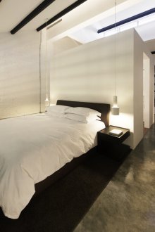 Black bed in the loft style