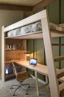 Wooden bed in the loft style