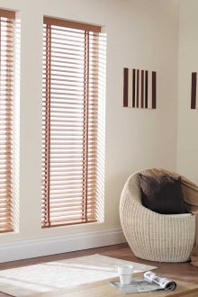 Narrow wooden blinds in the living room with a decorative fireplace