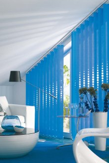 Vertical blue blinds with holes