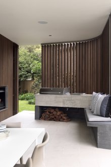 Vertical brown blinds in an open gazebo