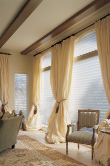 Translucent blinds and cream curtains in the living room