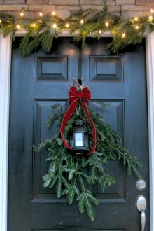 Christmas door decoration with fir branches