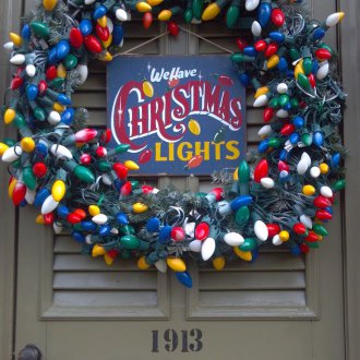 Decoration of the door with a garland for the new year