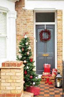 Christmas decoration of a gray door