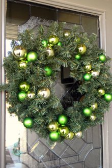Green door wreath decoration