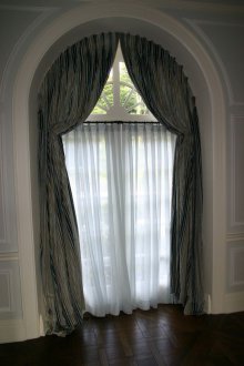 Interior arch with curtains