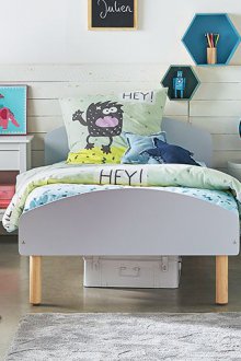 Wooden furniture in a nursery for three