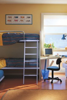 Children's room for three children with a table