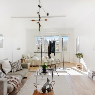 Budget repairs in a studio apartment with a bed