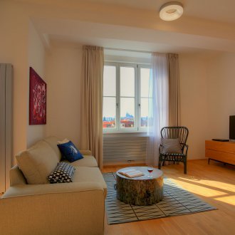 Bedroom in a one-room apartment in a simple design