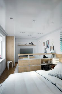 Bedroom in a studio apartment with furniture