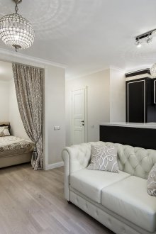 Bedroom in a one-room apartment in the neoclassical style