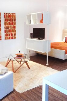 The bedroom in a studio apartment is simple