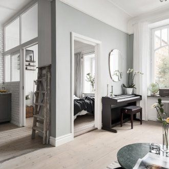 The bedroom in the studio apartment is gray