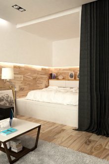 Bedroom in a studio apartment with a textile partition