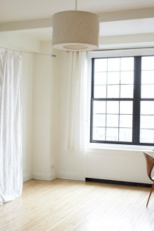 Bedroom in a studio apartment with a fabric partition